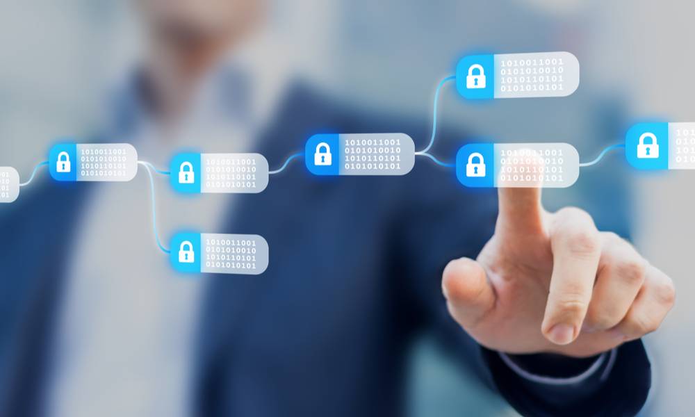 Blockchain technology concept with a chain of encrypted blocks and person in background.jpg