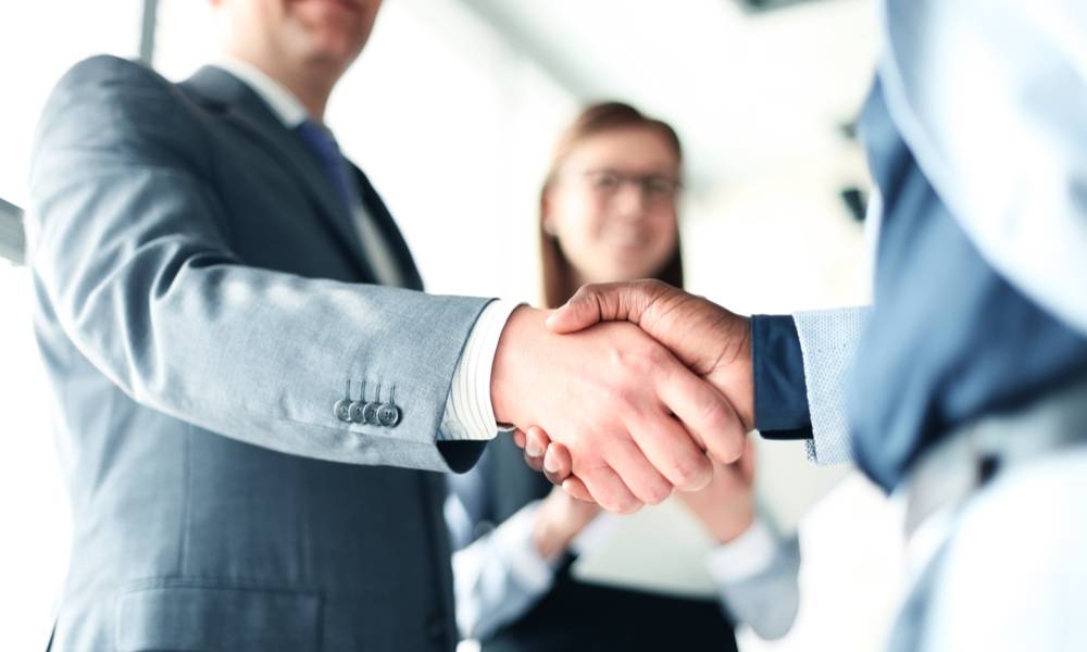 Business people shaking hands, finishing up a meeting (1).jpg