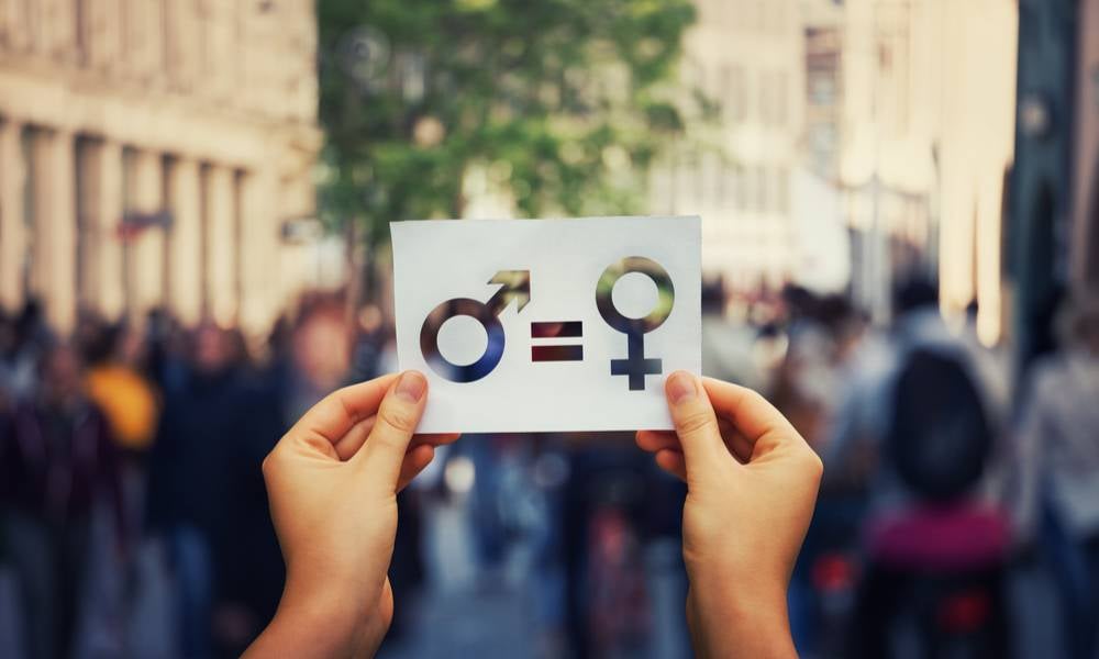 Hands holding male female gender equlity sign.jpeg