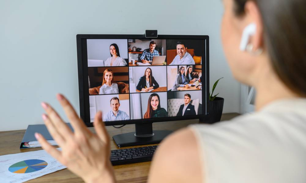Colleagues video calling into morning meeting online.jpg