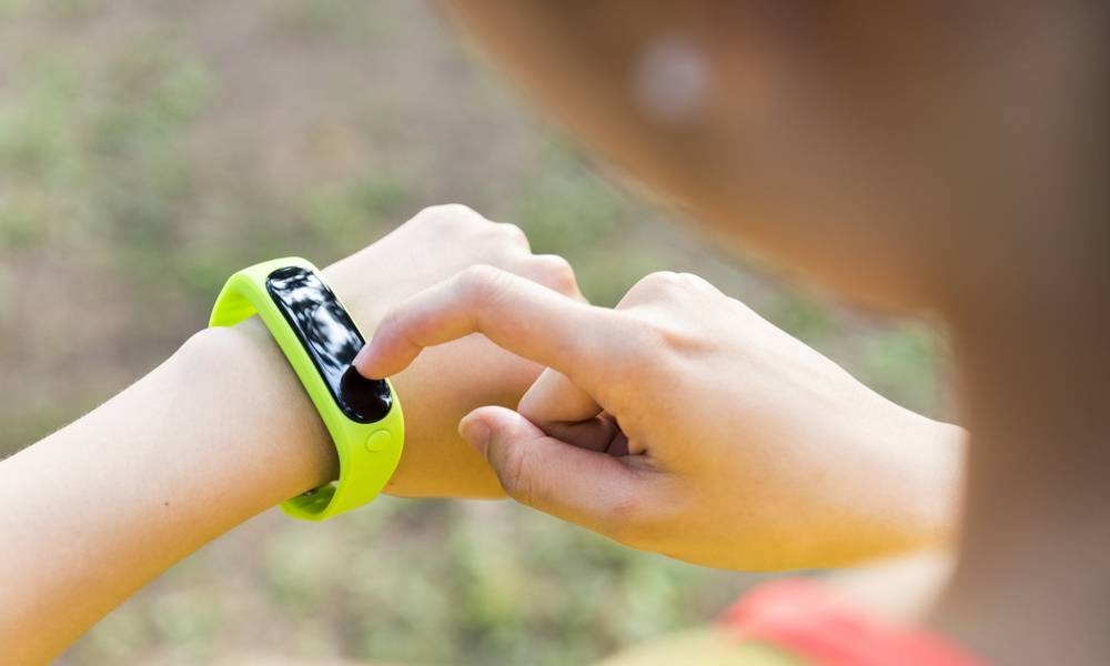 Woman exercising with fitbit.jpg