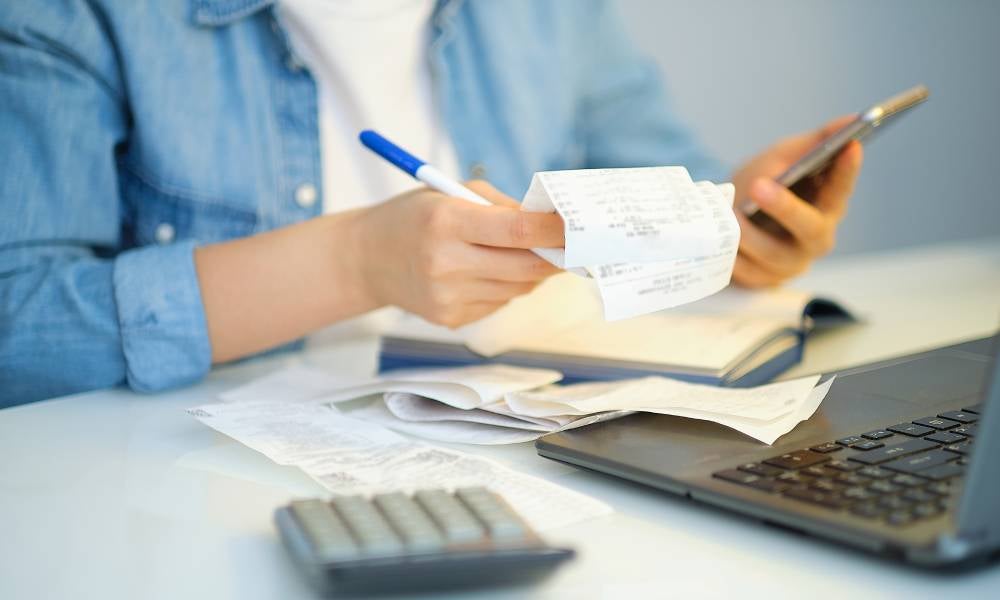 Unemployment JobSeeker person calculates bills.jpeg