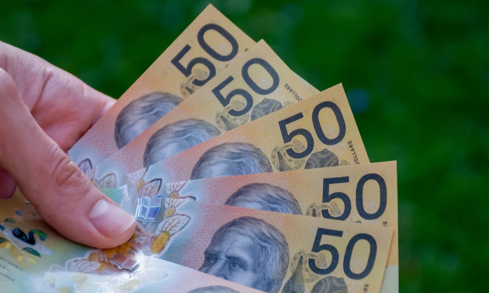 Handful of fifty dollar bills.jpg