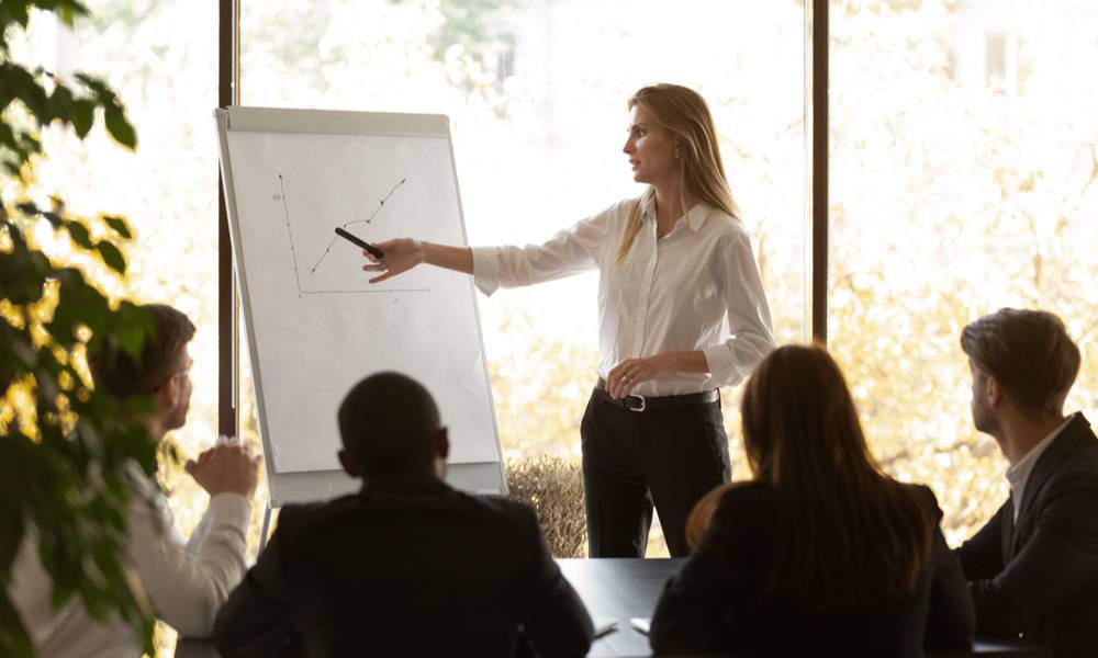 Businesswoman presenting investment growth figures to colleagues (1).jpg