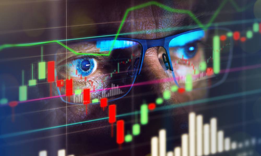 Close up of stock market trader looking at graph of share prices (1).jpg