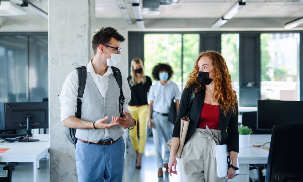 Colleagues leave work wearing protective masks (1).jpg