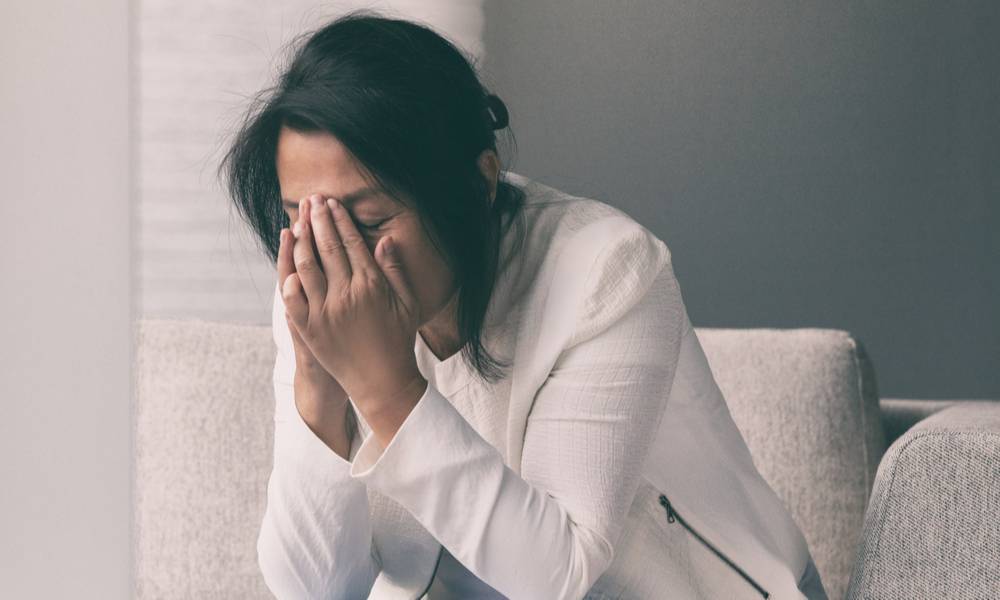 Woman in distress head in her hands due to unemployment (1).jpg