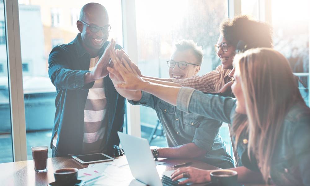 Group of colleagues high five-min.jpg