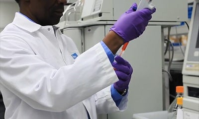 man in a lab holding equipment