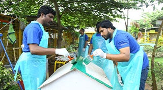 two men painting a shelter
