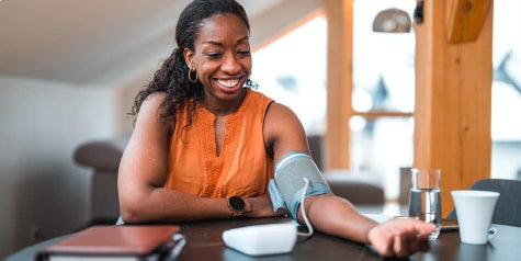 Black female in 40s takes her blood pressure