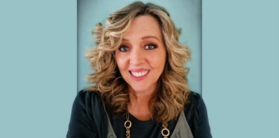 Kathy Saldana - white female smiling for camera