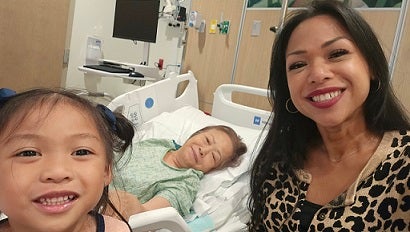 Krystle and daughter, Eva, visiting Lola (tagalog for “Grandma”) at Baptist Hospital.
