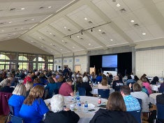 Crowd of people at symposium