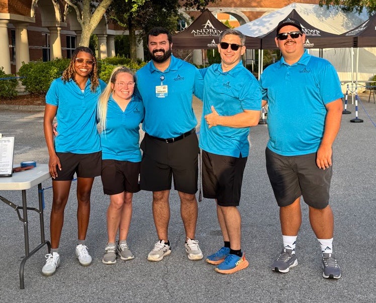 Andrews Institute group picture of Athletic Trainers posing together.