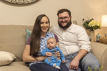 Wriston family sitting on a sofa.