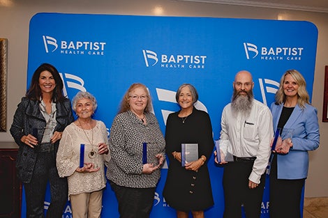 Hollinger Award Winners. Six people holding awards. Baptist Health Care Foundation, Pensacola