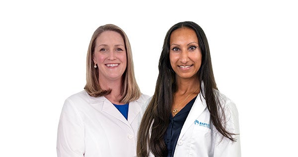 Professional portrait of two healthcare providers in clinical coats, photographed against a neutral background for use in provider profiles, marketing materials, and digital communications.