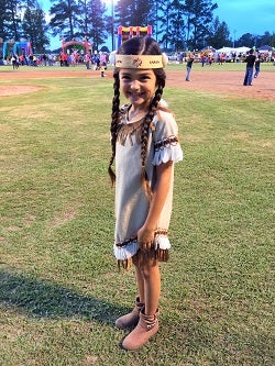 Girl dressed in Native American tribe clothing