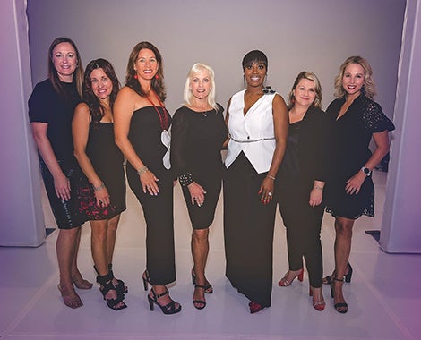 Baptist Health care Foundation Women's Board members posing on runway