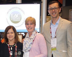 Dr. Giedrimas and others posing with award