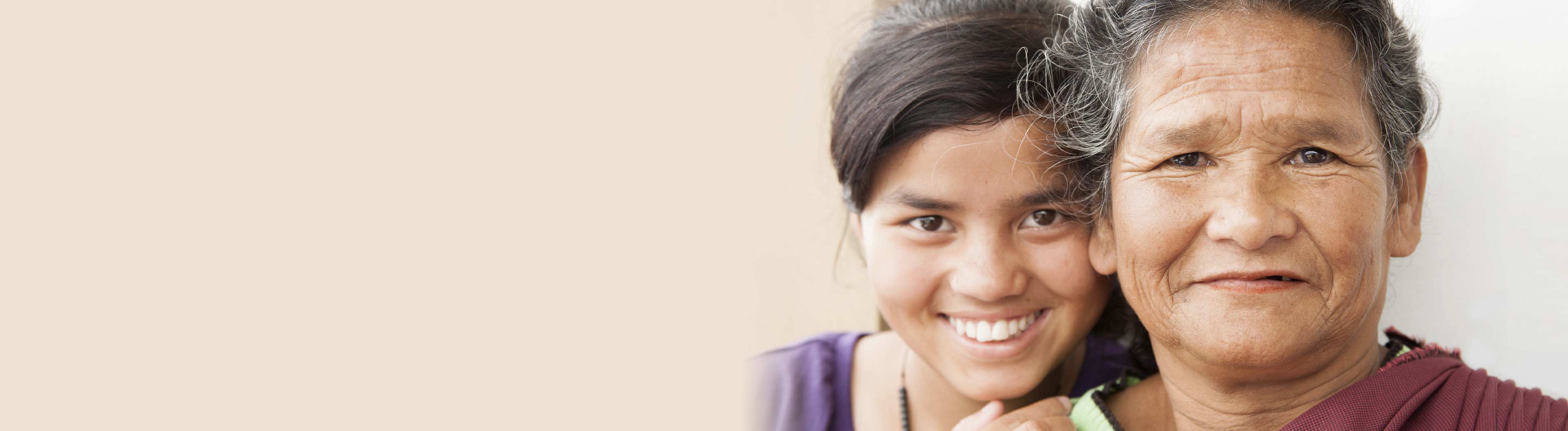 Woman hugging each other while laughing