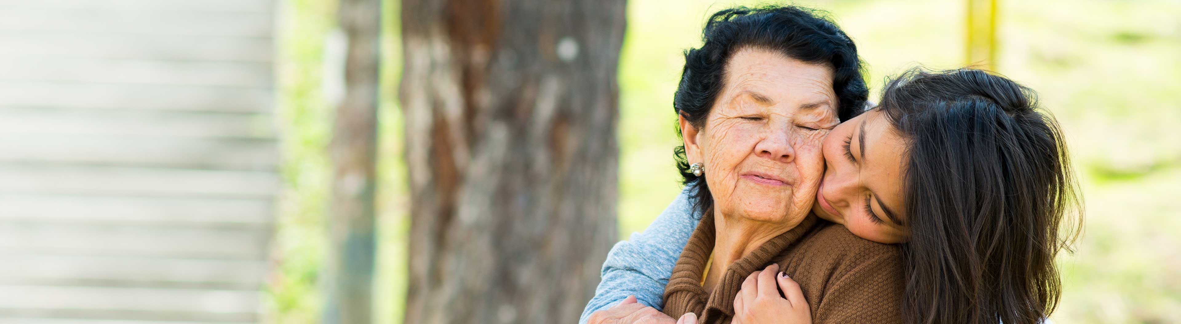 Woman hugging each other while laughing