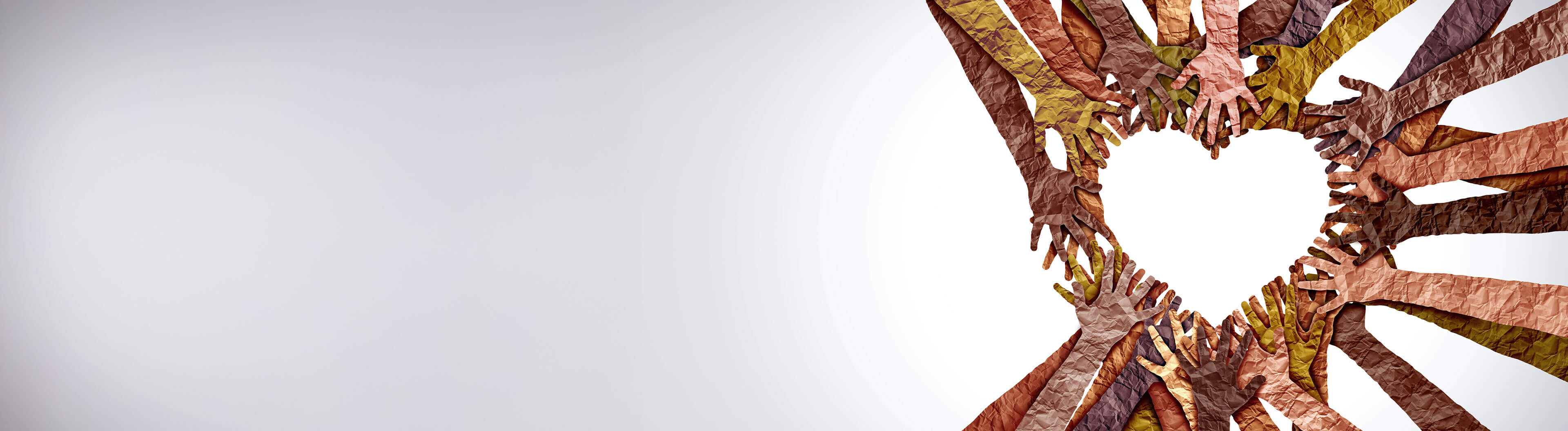 Paper hands coming together to form a heart