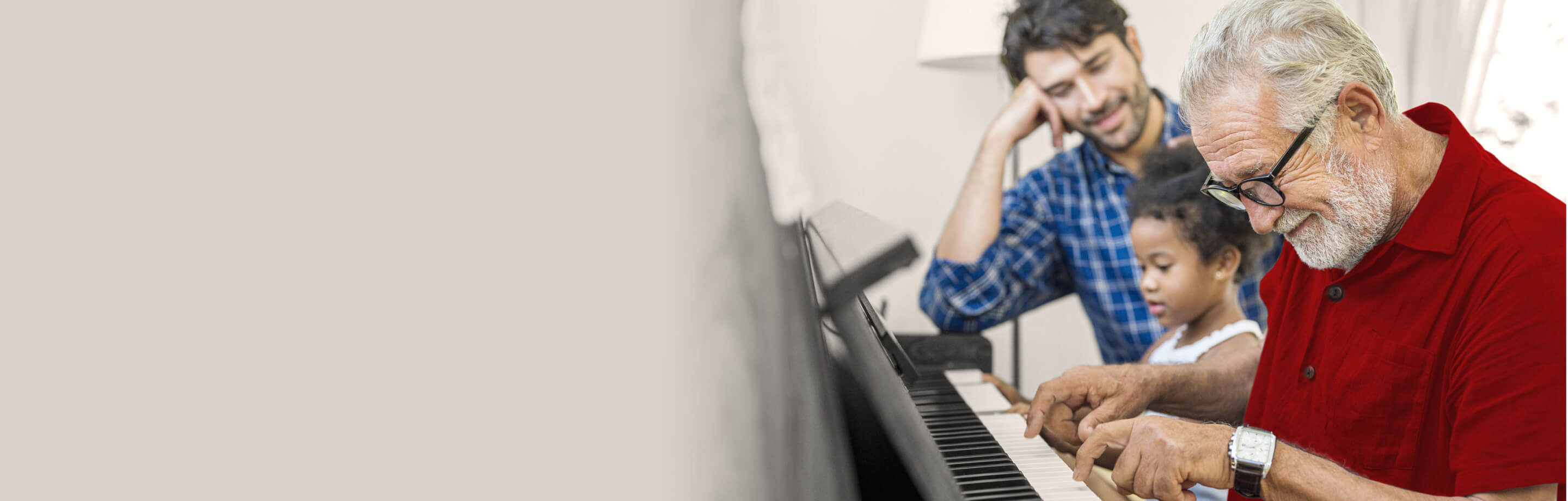 Old man playing piano for his grand children