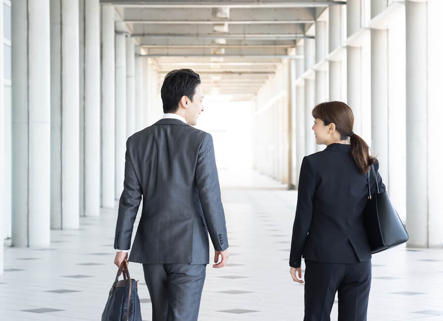 two employees walking together
