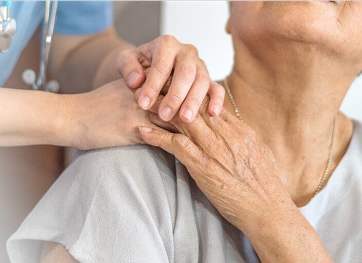 doctor holding patient hand