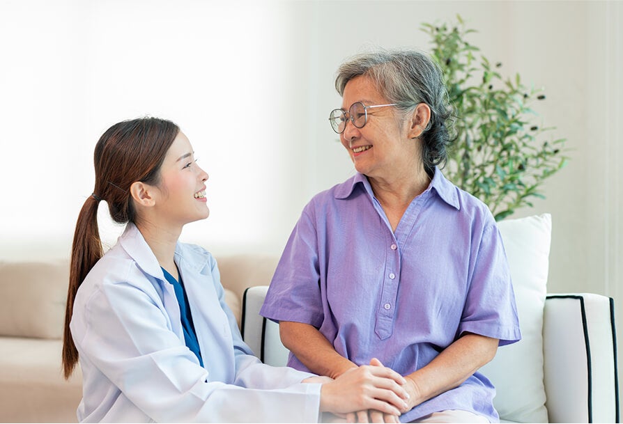 patient smiling to a doctor