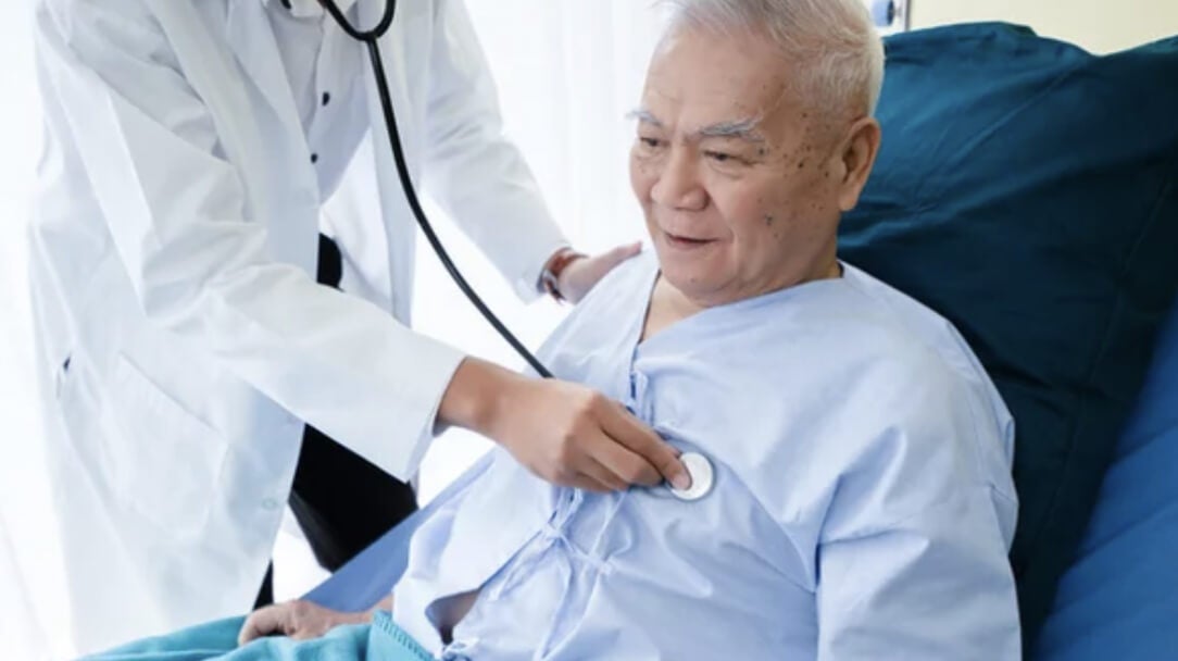 Doctor listening to patients heart