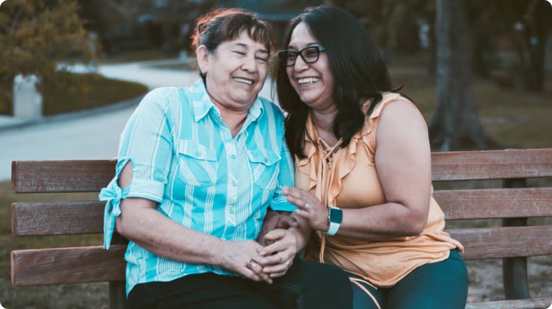 two women laughing together