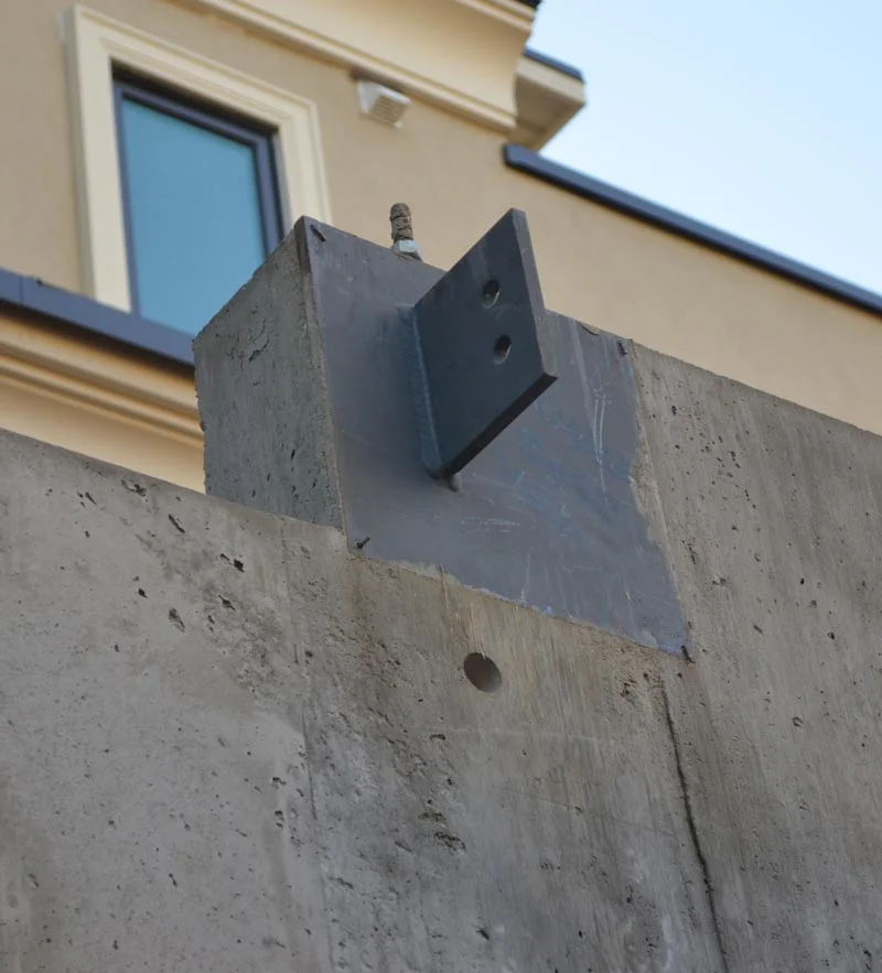 Shear plate connected to a corner embedded plate