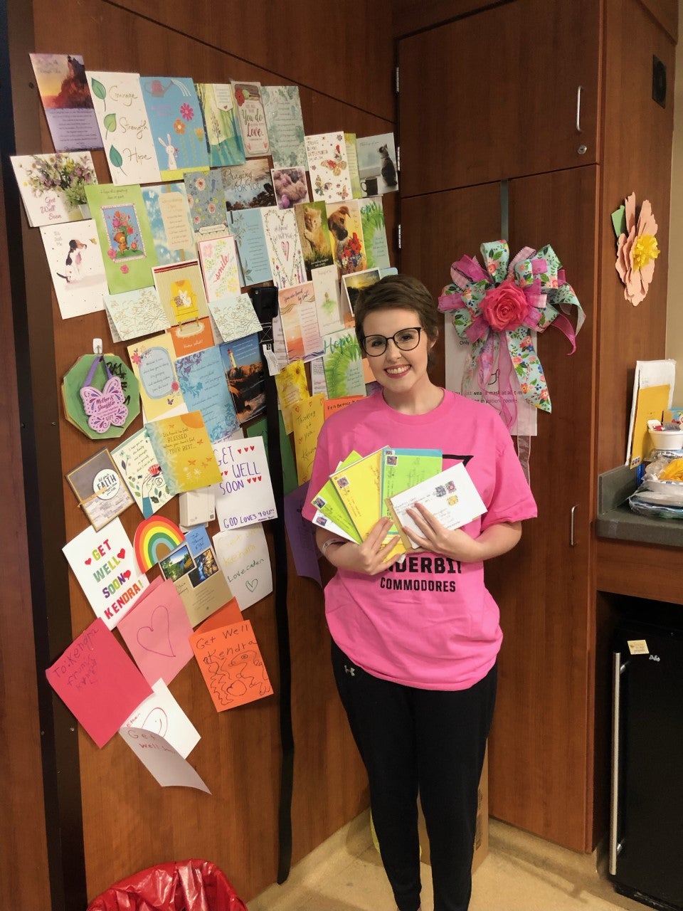 Kendra with her cards from family and friends