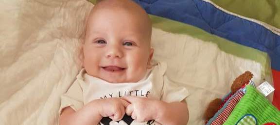 Baby Michael smiling.