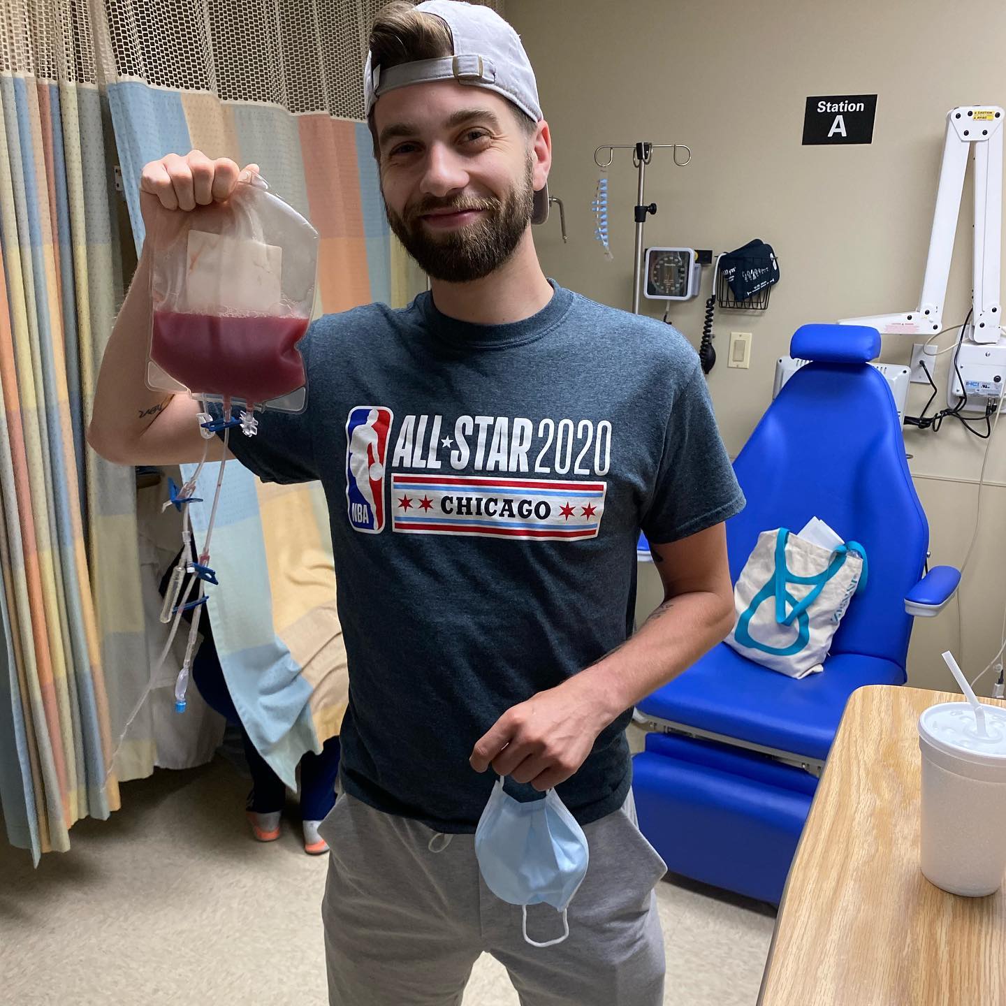 Ransom donor holding blood bag