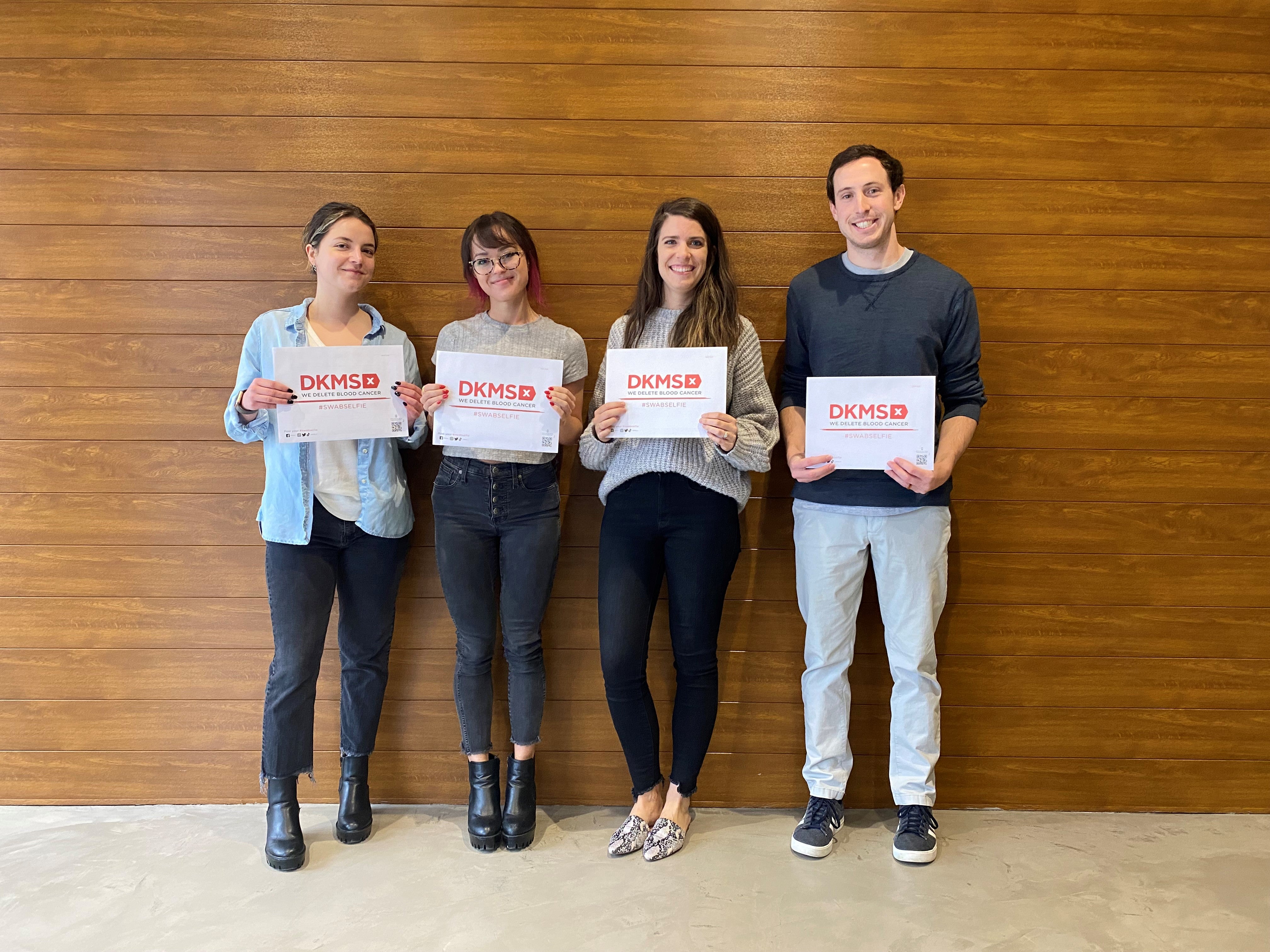 The new Charlotte team smiling at the camera