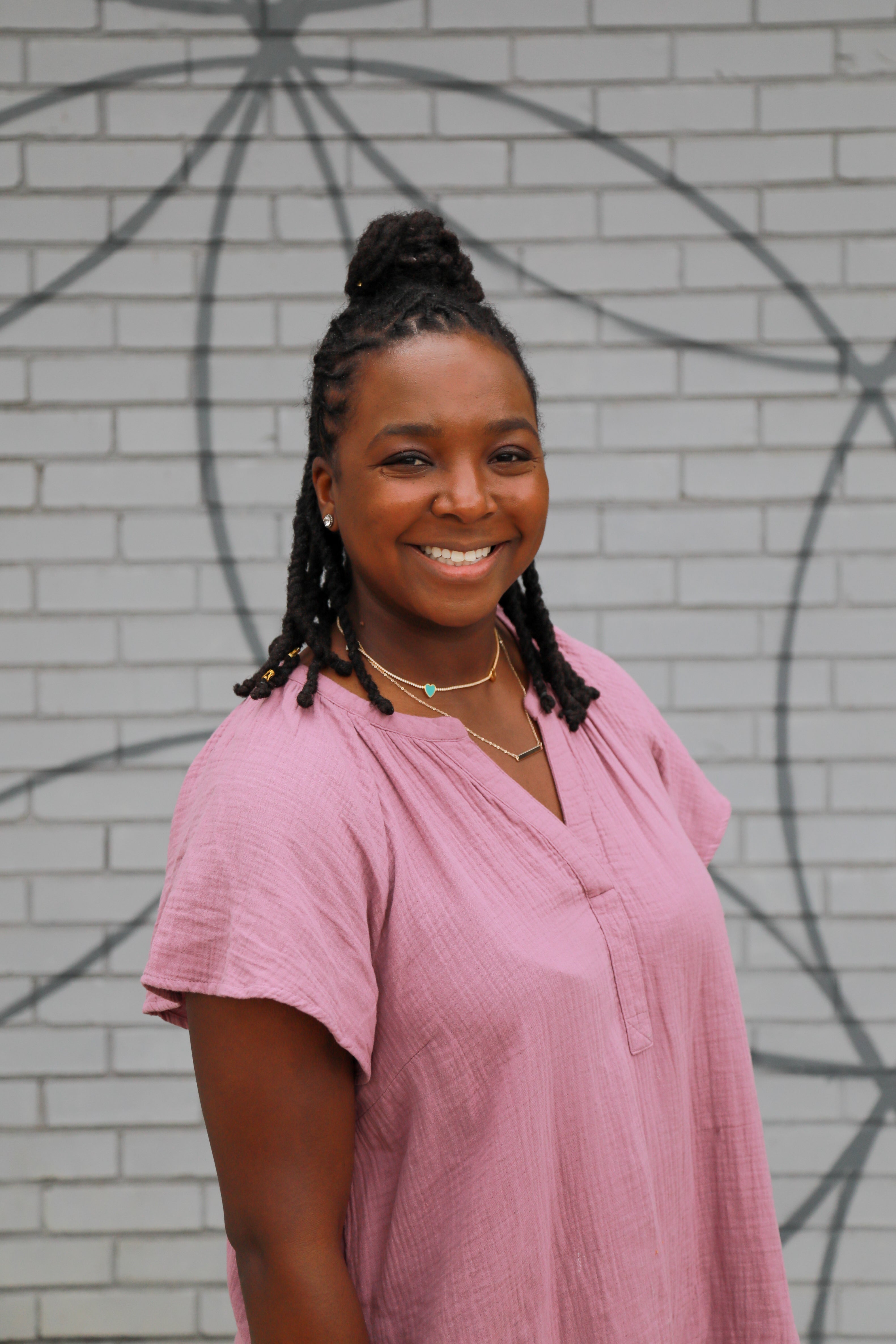 Blood stem cell donor, Jasmine Thompson, smiling as she shares her donation story for a patient with sickle cell 