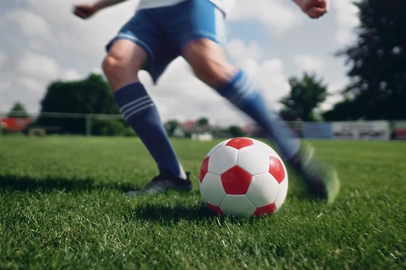 Soccer player at a DKMS charity event