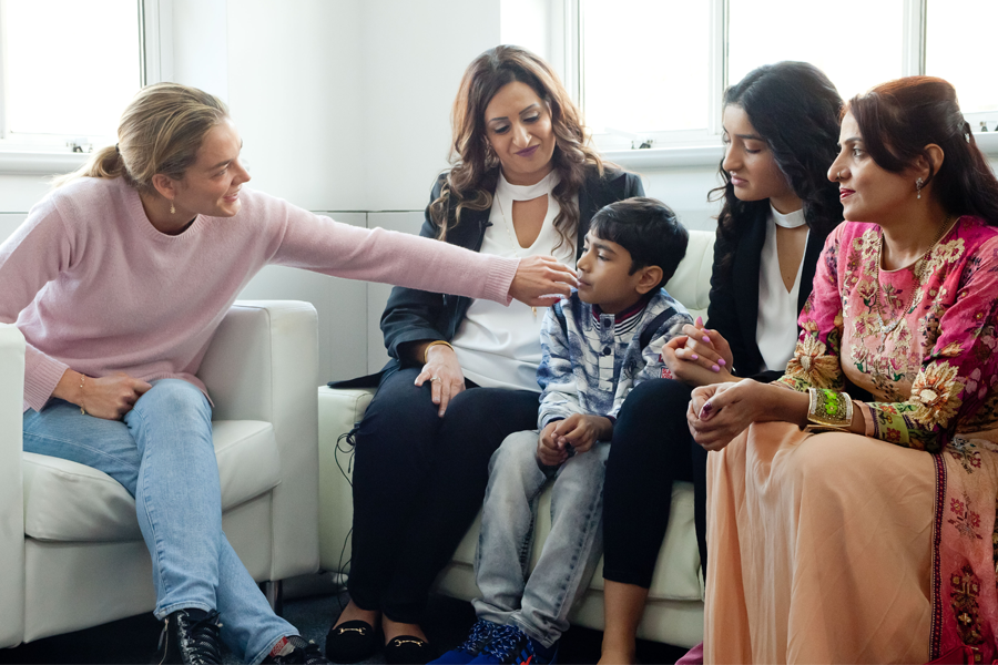 Katharina Harf meeting with a patient and their family