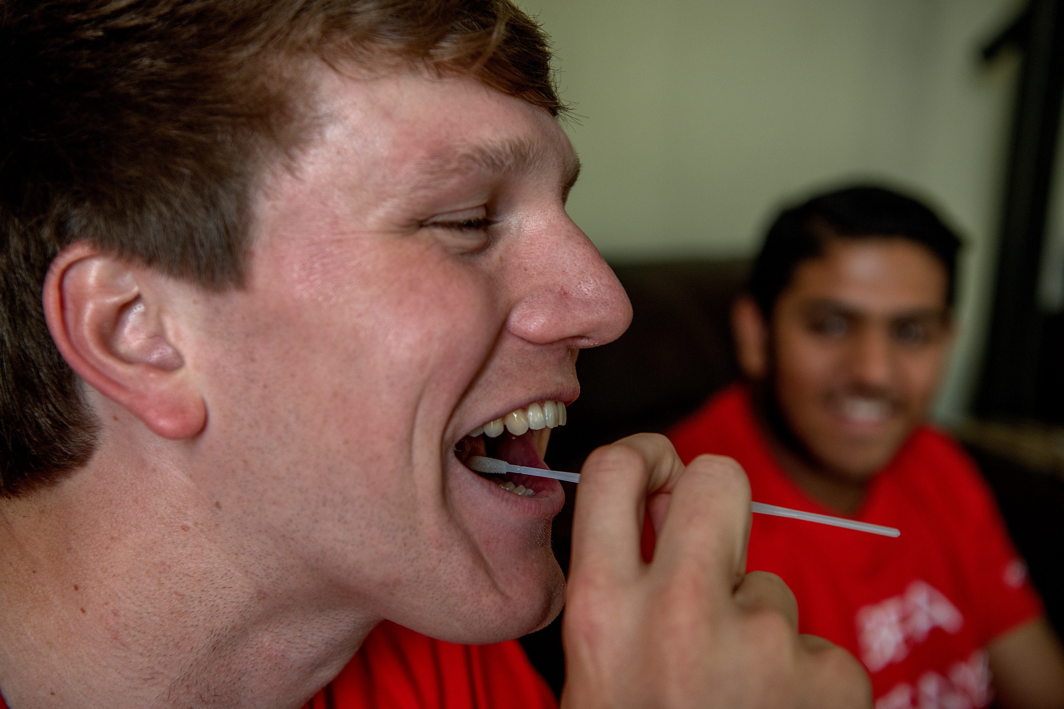 DKMS Donor swabbing cheeks 