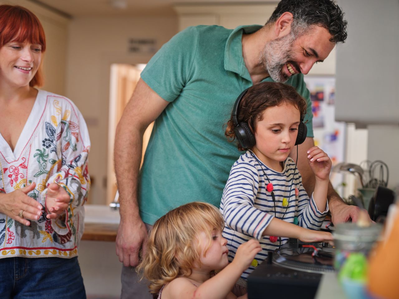 Parents and daughters in ktichen