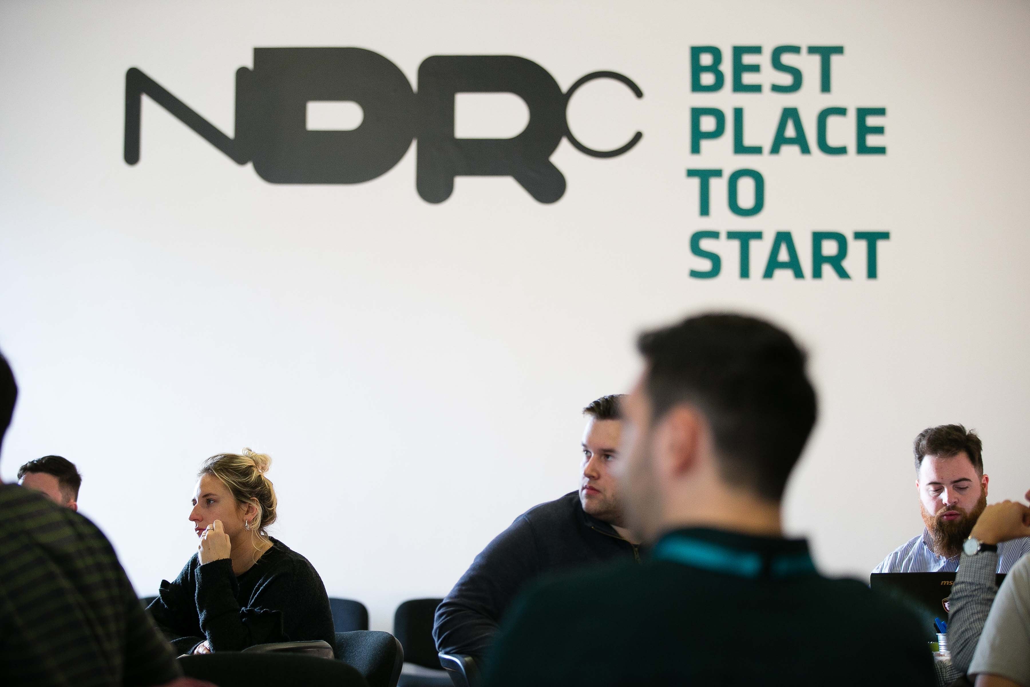 students sitting looking into the distance