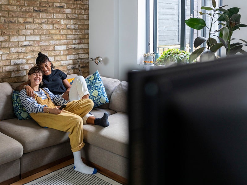 Couple on couch watching tv