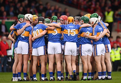 Hurling team standing in a huddle
