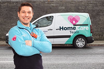 Boiler Service Engineer standing in front of HomeCare Team van on a street