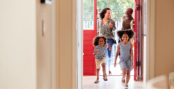Family entering building