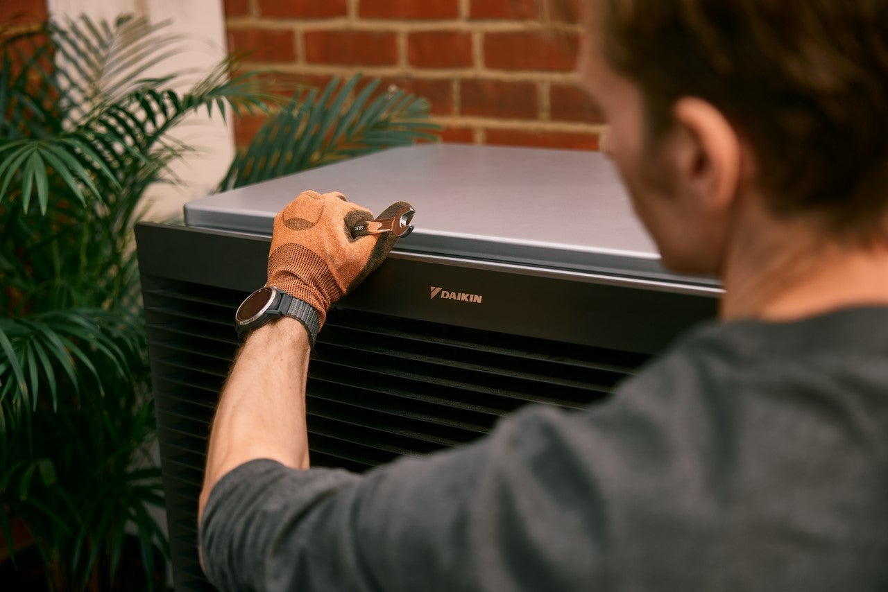 Man installing heat pump